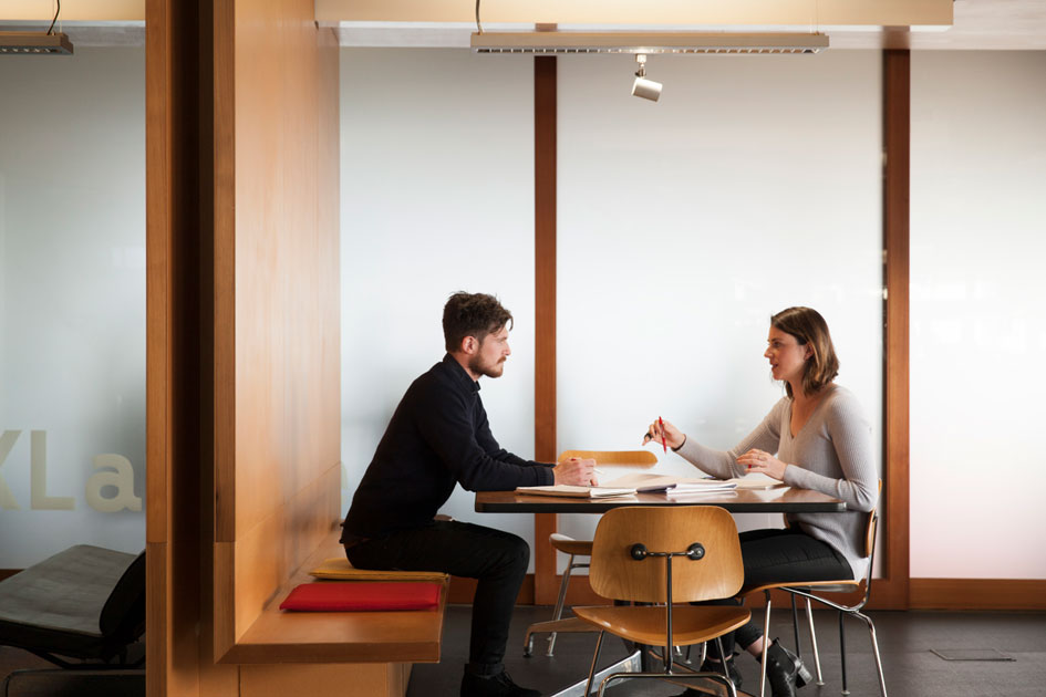 Two workers having a meeting in an office